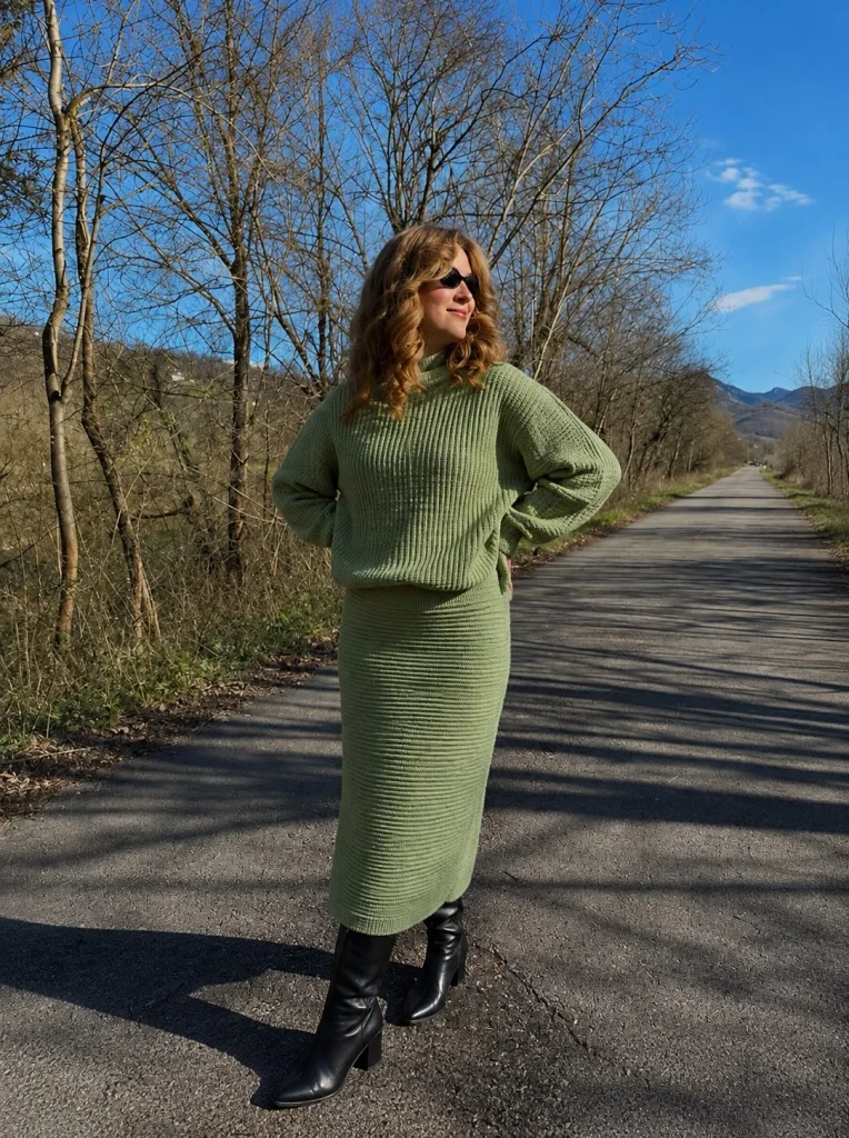 Long black boots with a matching knit skirt set