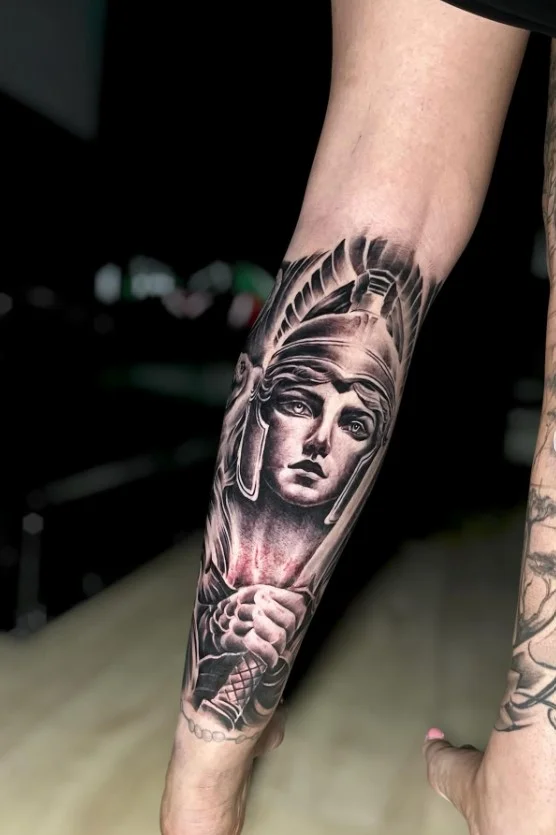 Medusa half leg tattoo for women with detailed snakes and ornamental elements