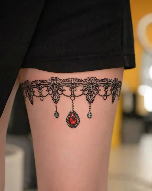 Ornamental lace half leg tattoo for women with delicate decorative details