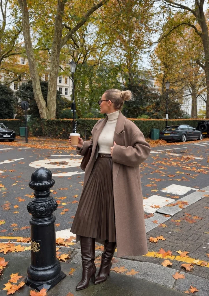Pleated midi skirt and turtleneck with dark brown knee high boots