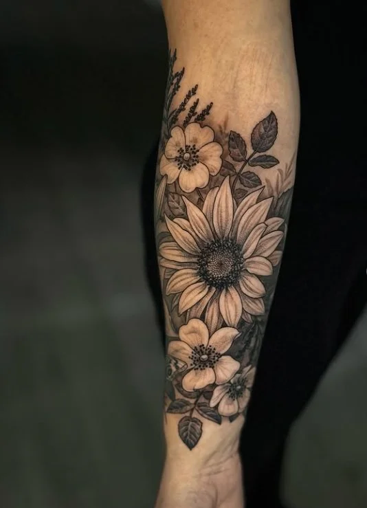 Sunflower forearm tattoo featuring a bold recognizable floral design