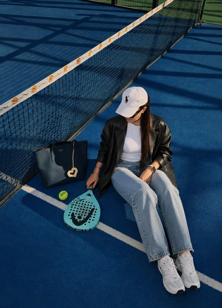 Casual tennis bracelet outfit with blue jeans, a white T-shirt, and a leather jacket