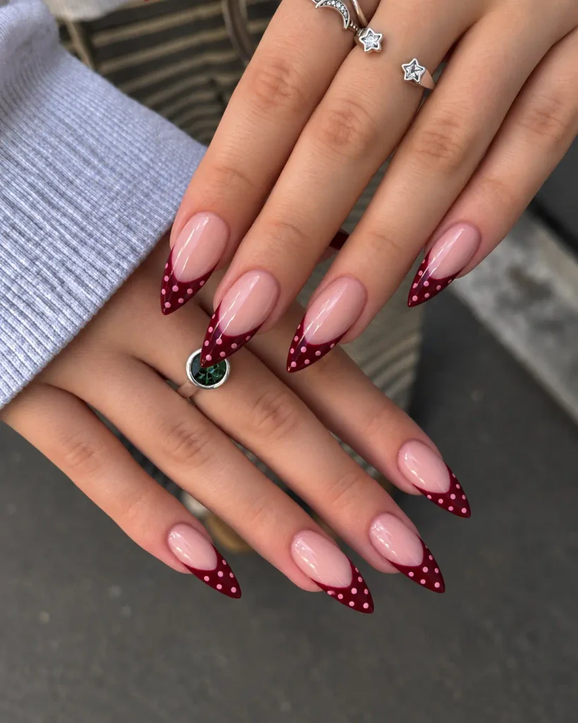 Pink nails with burgundy French tips and small pink polka dots