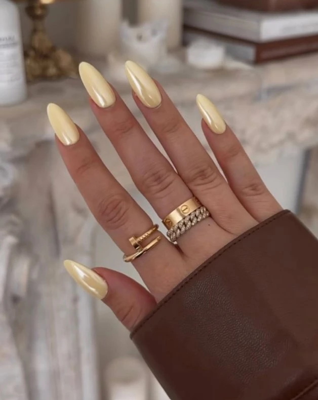 Butter yellow acrylic nails with a creamy pastel color and glossy finish.