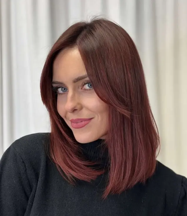 Cherry cola hair with a deep brunette base and subtle burgundy red reflections