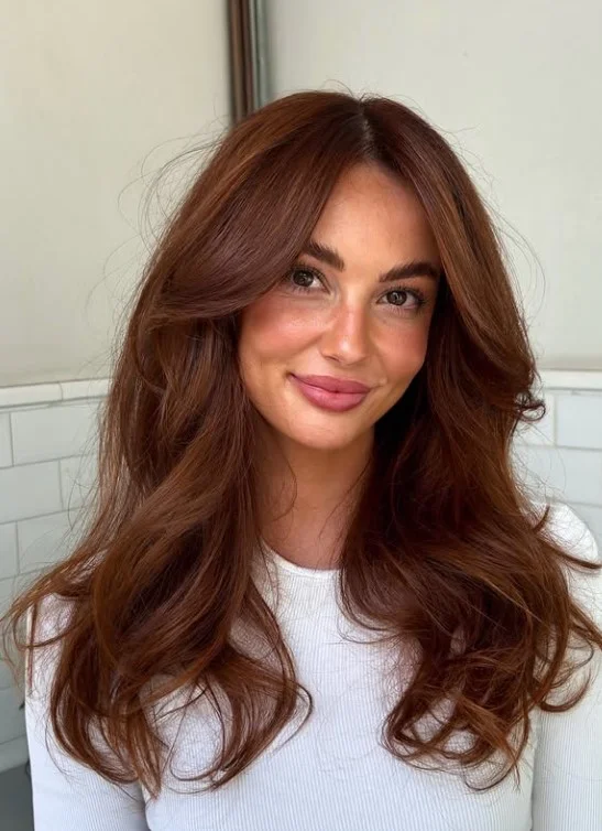 Copper auburn hair with rich red and warm copper tones on olive skin