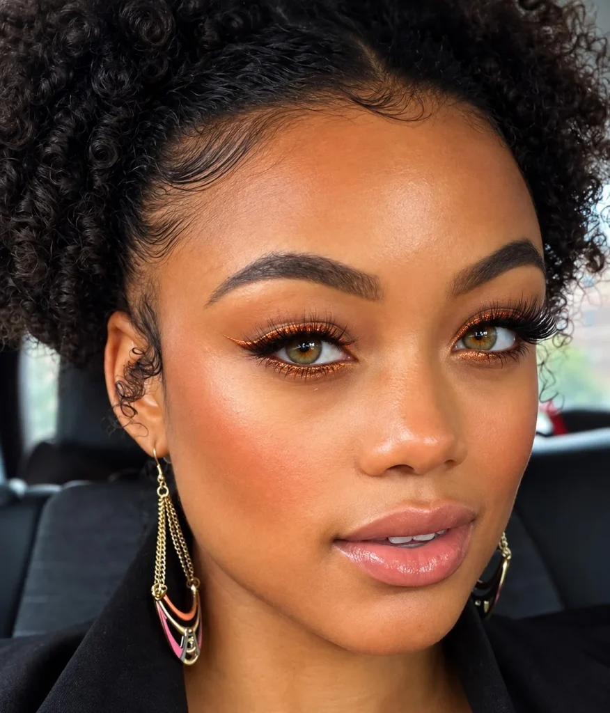 Hazel eyes with copper eyeliner highlighting amber and golden flecks