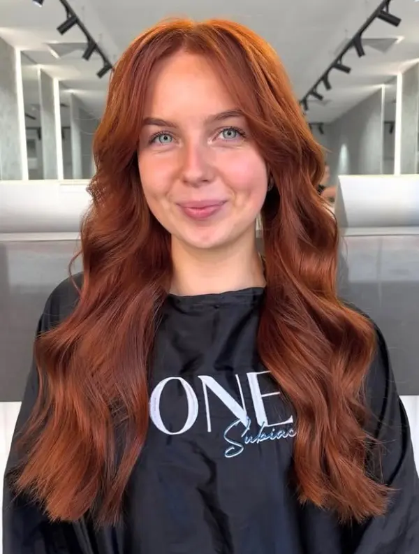 Cowboy copper hair with rich copper tones blended with brown undertones for a deeper muted red