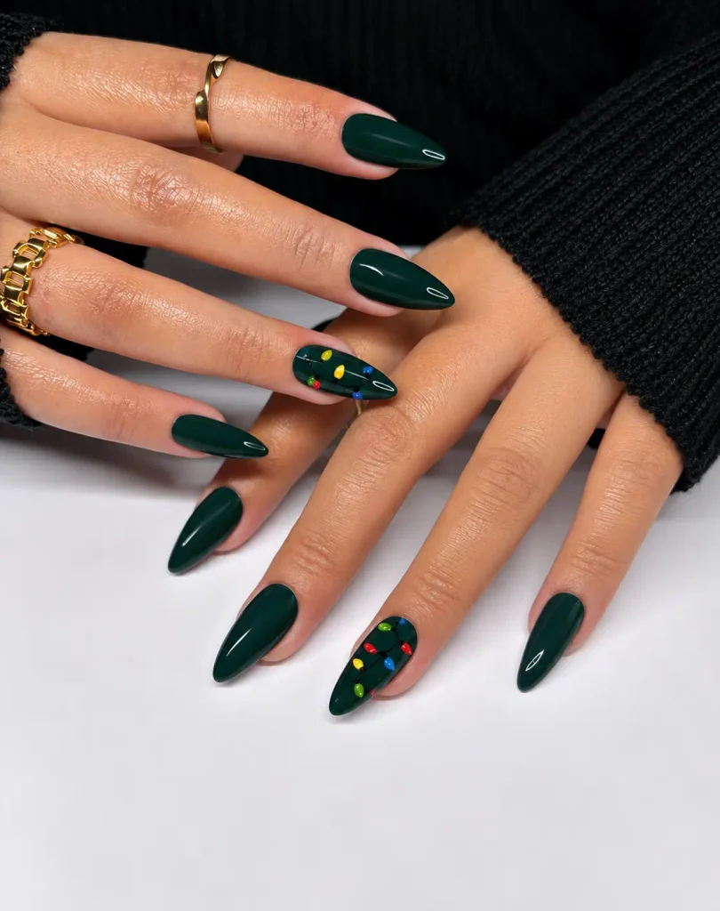 Dark green Christmas nails with colorful red, yellow, blue, and green string lights painted along fine dark wires