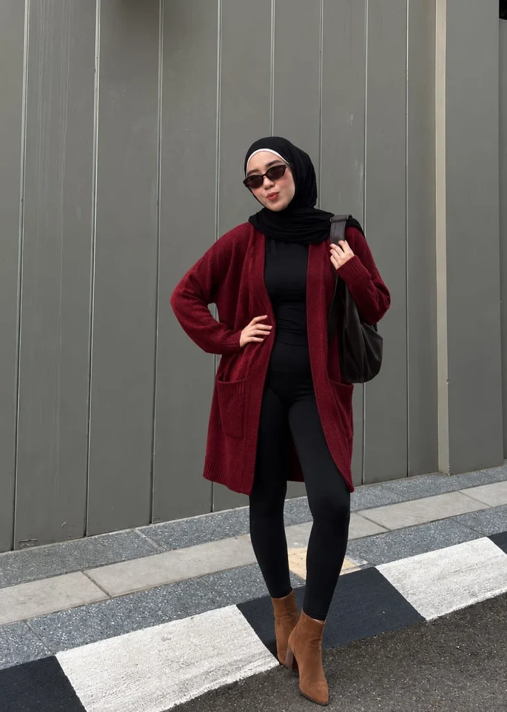 Dark red longline cardigan with black leggings and chestnut suede ankle boots
