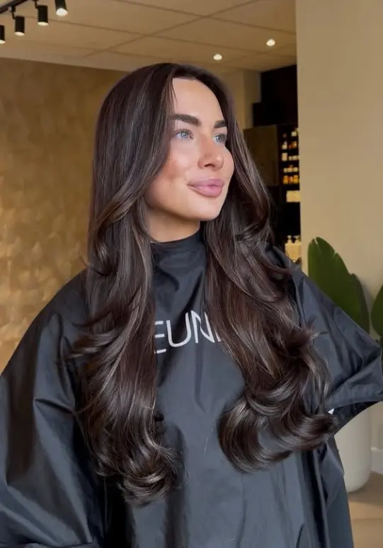 Espresso brown hair in a deep cool brunette shade for striking contrast with pale skin and blue eyes