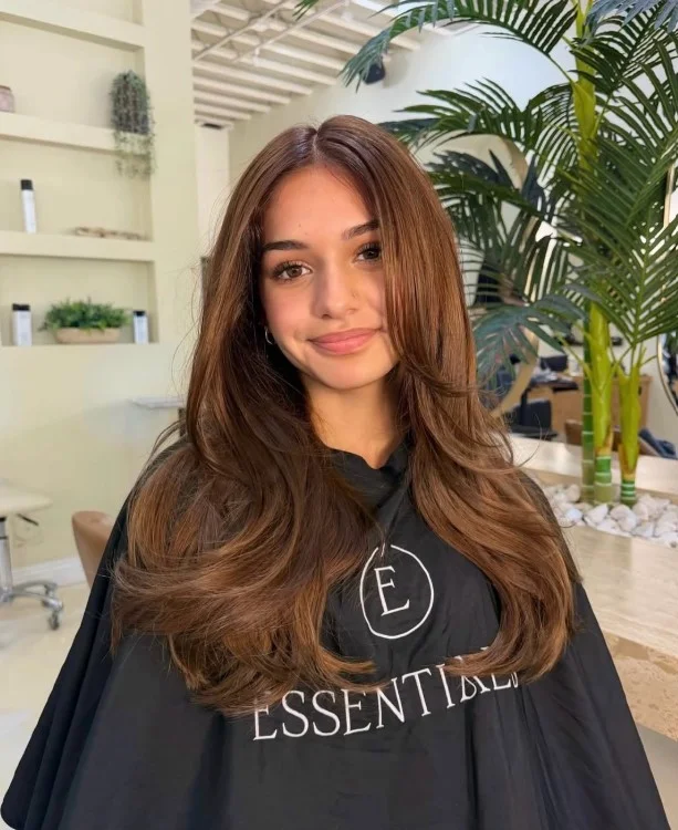 Golden brown hair with warm highlights on warm olive skin