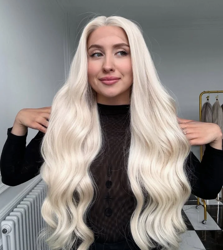 Icy platinum blonde hair with cool blonde tones on olive skin