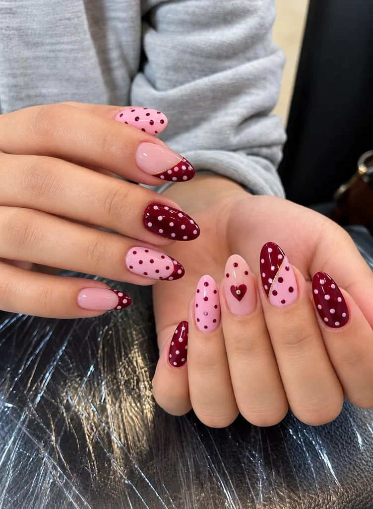 Burgundy and pink nail designs combining polka dots, French tips, and color blocks