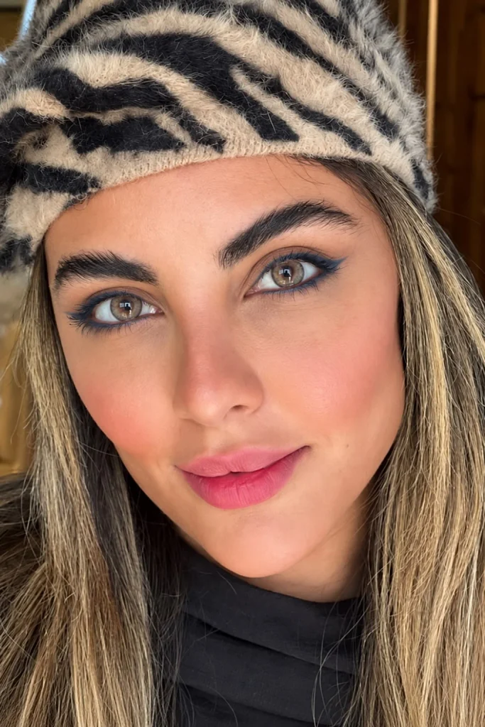 Hazel eyes with navy eyeliner for defined eye makeup without harsh black