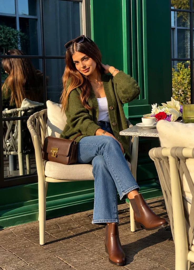 Olive green cardigan with blue jeans and brown Chelsea boots