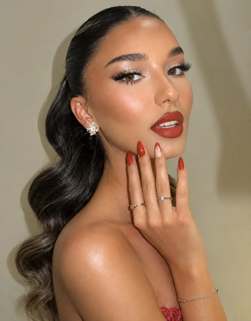 Paprika red lipstick in a warm, slightly muted orange-red shade.