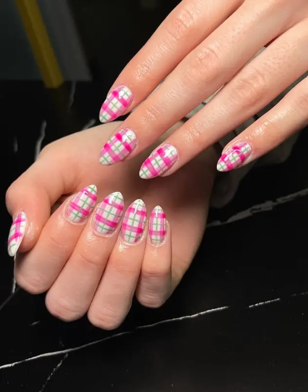 Pink and green Christmas plaid nails with thin intersecting pink, green, and white lines