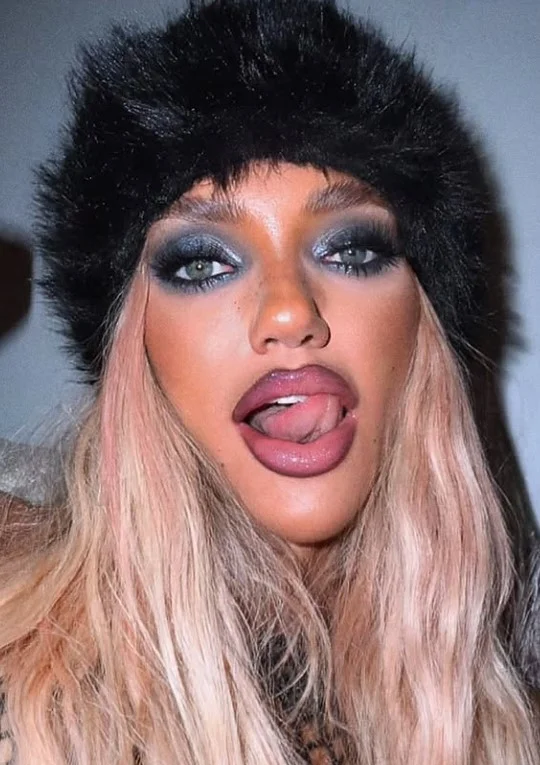 Woman wearing pinky-brown nude lipstick with soft pink and brown tones on brown skin