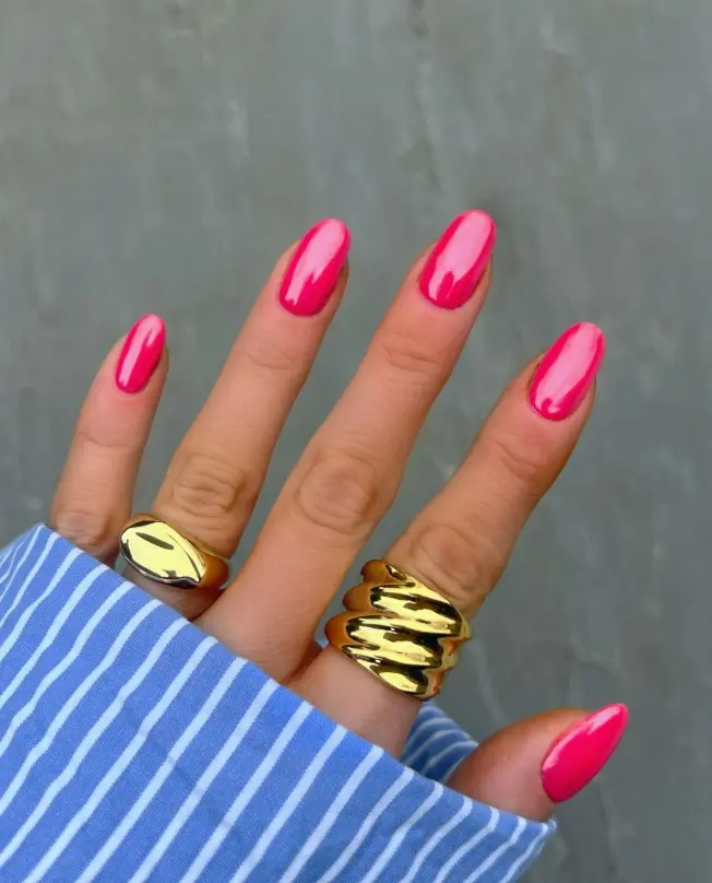 Translucent raspberry pink jelly acrylic nails with a glossy, glass-like finish.
