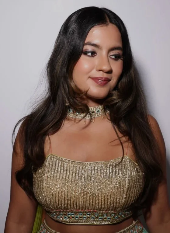Woman wearing rosy brown lipstick with soft pink-brown tones and natural makeup on brown skin